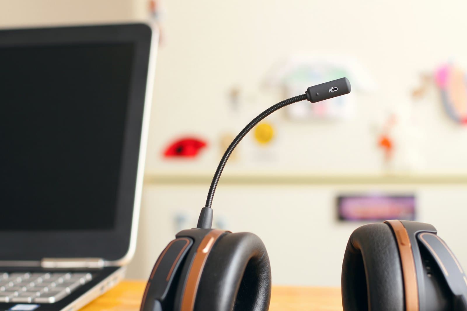 A headset resting beside a laptop