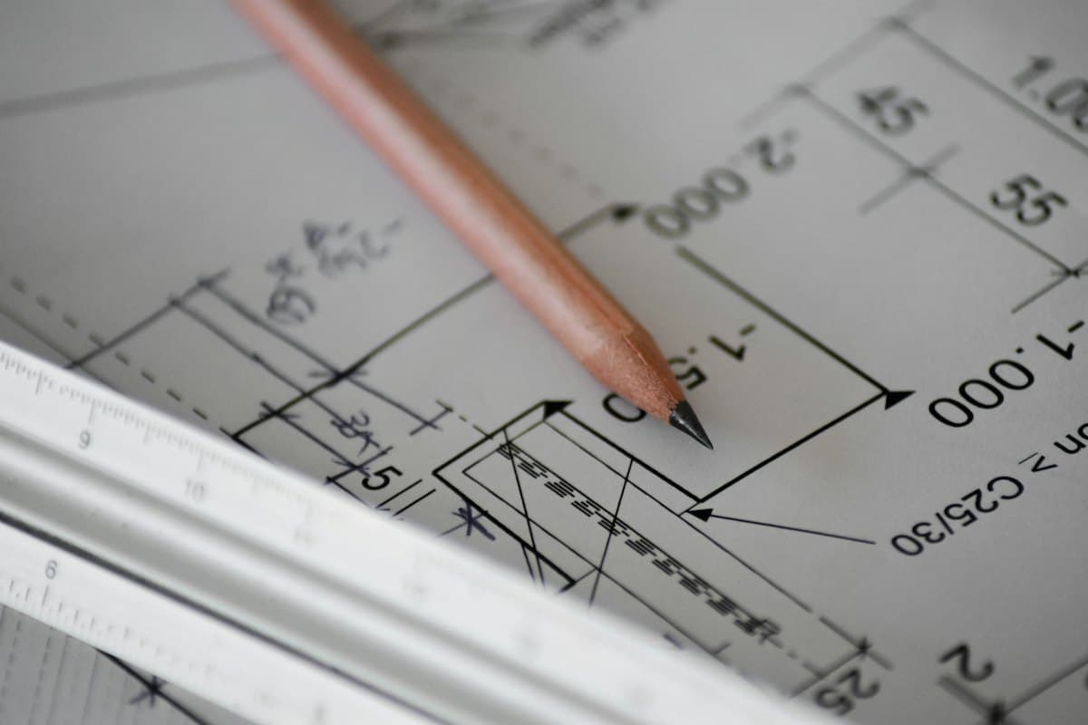 A pencil resting on a technical drawing